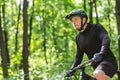Man In Helmet Cyclist Riding Bike In Forest