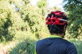 Man with helmet glove for safety riding a bicycle at countryside road along a forest,Cross country riding,cycling activity and Royalty Free Stock Photo