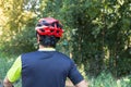 Man with helmet glove for safety riding a bicycle at countryside road along a forest,Cross country riding,cycling activity and Royalty Free Stock Photo