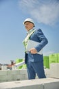 Man in a helmet holding a roll of paper Royalty Free Stock Photo