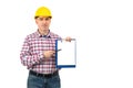 A man in a helmet holds a folder folder and ball pen with a white sheet in his hands.Builder in hardhat is holding a folder over Royalty Free Stock Photo