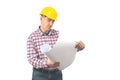 A man in a helmet holds with a roll of paper. Royalty Free Stock Photo