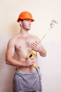 Man in helmet with a mixer for plastering Royalty Free Stock Photo