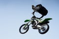 Man in a helmet performs a stunt in the air on a motorcycle Royalty Free Stock Photo