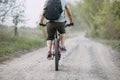 Man in helmet riding a bicycle at country road Royalty Free Stock Photo