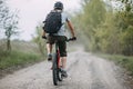 Man in helmet riding a bicycle at country road Royalty Free Stock Photo