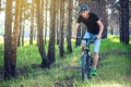 Man in a helmet riding on a mountain bike in the woods. Cyclist in motion. Concept of active and healthy lifestyle Royalty Free Stock Photo