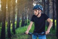 Man in a helmet riding on a mountain bike in the woods. Cyclist in motion. Concept of active and healthy lifestyle Royalty Free Stock Photo