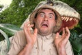 Man with helmet is running away from scary dinosaur Royalty Free Stock Photo