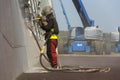 Man with helmet working on a bridge construction