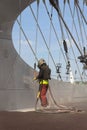 Man with helmet working on a bridge construction