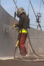 Man with helmet working on a bridge construction