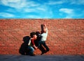 Man helped to climb a wall. The concept of friendship and help