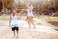 Man helping girl balance slackline Royalty Free Stock Photo