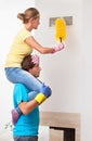 Man helping his wife in cleaning Royalty Free Stock Photo