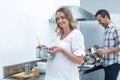 Man helping pregnant woman prepare food Royalty Free Stock Photo