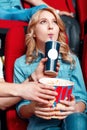 Man helping woman with snacks in cinema Royalty Free Stock Photo