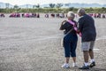 Man Helps Woman Put on Survivor Sash at Breast Cancer Walk Royalty Free Stock Photo