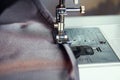 A man hem a curtain on a sewing machine. Sewing, hobbies, hobby, home improvement