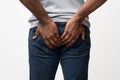 Man with hemorrhoids holding his butt in pain Royalty Free Stock Photo