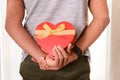 Man hidding Heart shaped Box Present Royalty Free Stock Photo