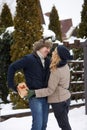 Man is hides box behind his back and going to give his woman a present on Valentine`s Day, Christmas or New Year Royalty Free Stock Photo