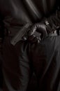 Man hiding a gun Royalty Free Stock Photo