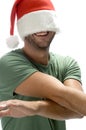 Man hiding his face with santa cap Royalty Free Stock Photo