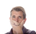 Man hiding his true emotions by covering his mouth with a fake s Royalty Free Stock Photo