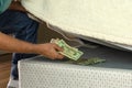 Man hiding money under his mattress because he doesn`t trust banks