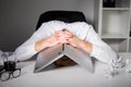 Man hiding under laptop Royalty Free Stock Photo