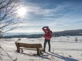 Man hiker with backpack looking to landscape