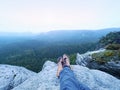 Man hiker climb rock on mountain peak cliff. Concept of sport and active life. Royalty Free Stock Photo