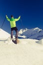 Man hiker or climber accomplish in winter mountains