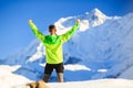 Man Hiker Or Climber Achievement In Winter Mountains