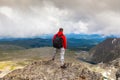 Photographer traveler on high mountain Royalty Free Stock Photo