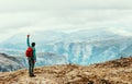 Man hiker enjoying mountains landscape Travel