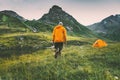 Man Hiker And His Camping Tent In Mountains Travel Adventure