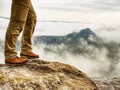 Man hiker legs with windproof trousers and hiking boots Royalty Free Stock Photo