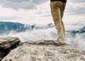 Man hiker legs with windproof trousers and hiking boots Royalty Free Stock Photo