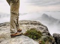 Man hiker legs with windproof trousers and hiking boots Royalty Free Stock Photo