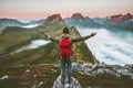 Man hiker raised hands exploring mountains of Norway Royalty Free Stock Photo