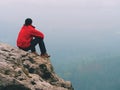 Man hiker sit on rocky summit Royalty Free Stock Photo