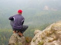 Man hiker sit on rocky summit Royalty Free Stock Photo