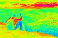 Man hiker sitting in nature. Infrared thermal radiation