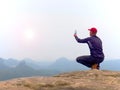 Man hiker takes photo by mobile phone Royalty Free Stock Photo