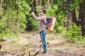 Man hiker taking photo smart phone in forest. Attractive Traveler Making Photo With Mobile Phone. Traveler hiker man Royalty Free Stock Photo