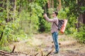 Man hiker taking photo smart phone in forest. Attractive Traveler Making Photo With Mobile Phone. Traveler hiker man Royalty Free Stock Photo