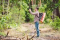 Man hiker taking photo smart phone in forest. Attractive Traveler Making Photo With Mobile Phone. Traveler hiker man Royalty Free Stock Photo