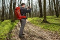 Man hiker taking photo with smart phone in forest Royalty Free Stock Photo